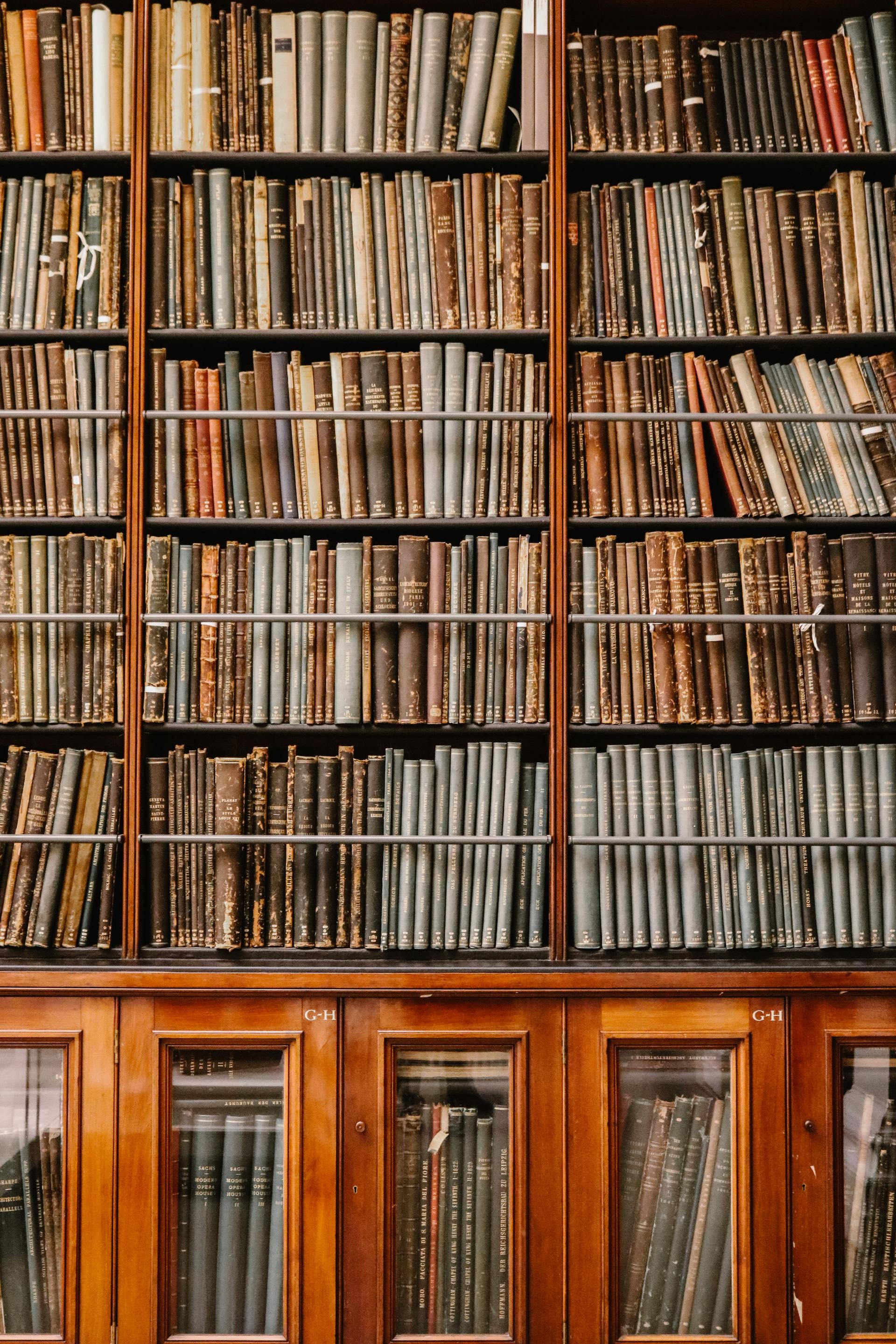 Shelves of old bound volumes in a library