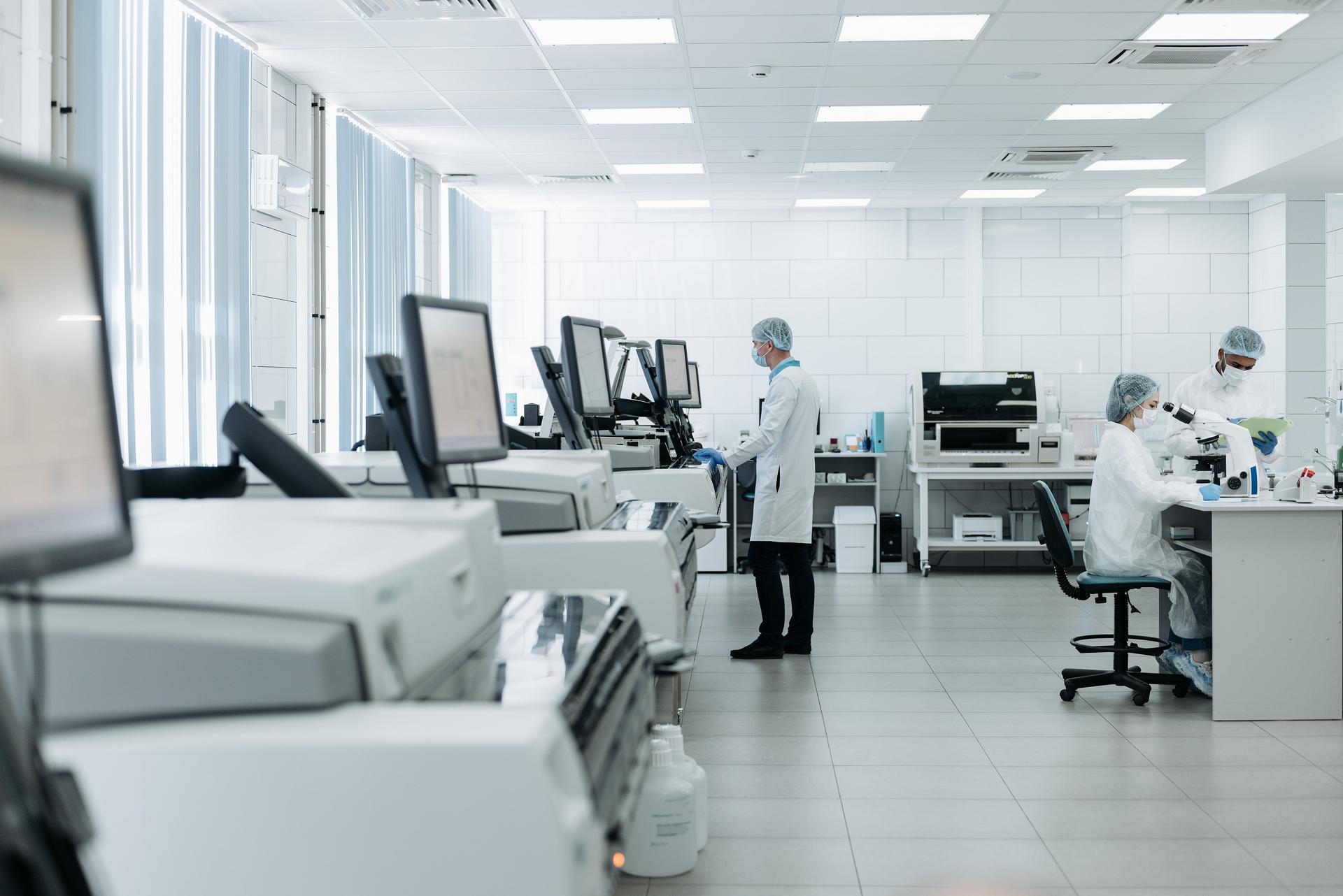 A forensic laboratory with analysis instruments and scientists at work